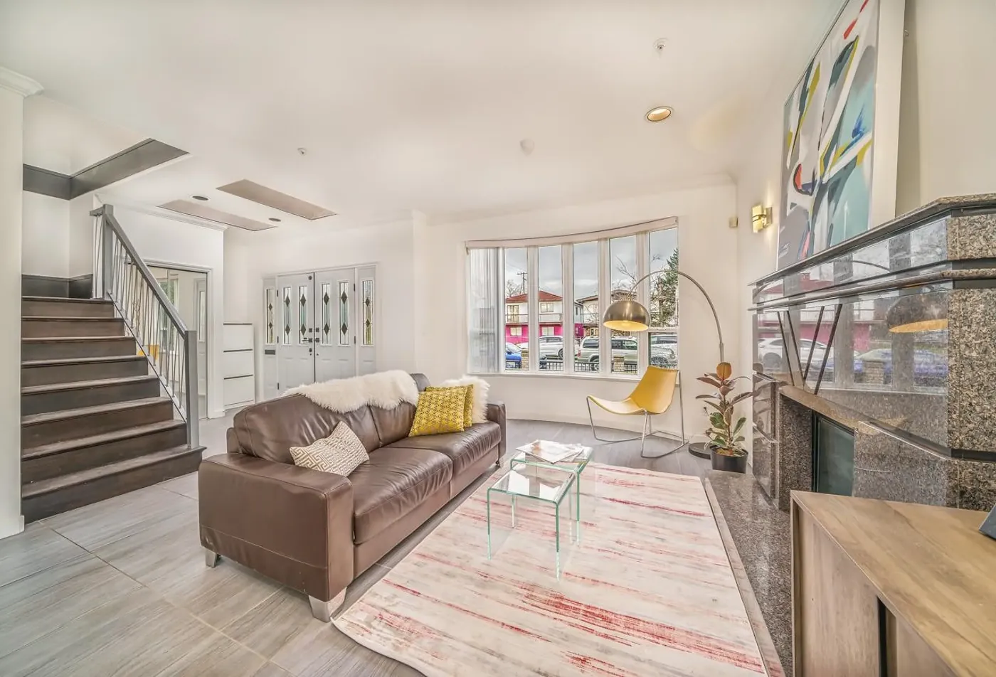 Living room with bay window at 3108 East 6th Ave