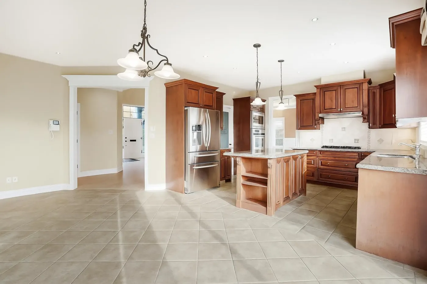 Kitchen with granite island at 3660 Raymond Ave