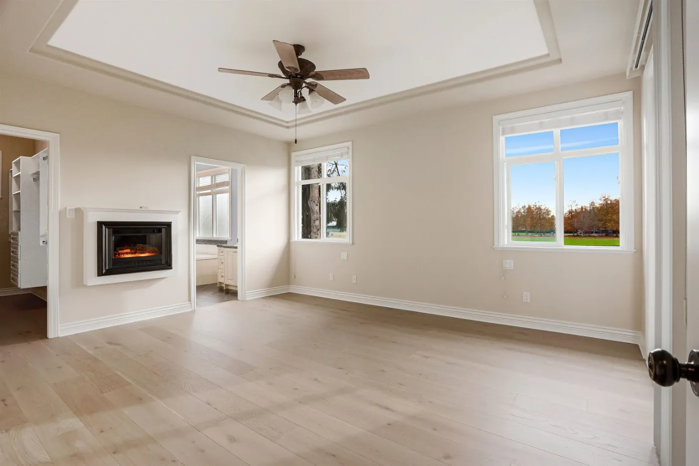 Primary bedroom with fireplace at 3660 Raymond Ave