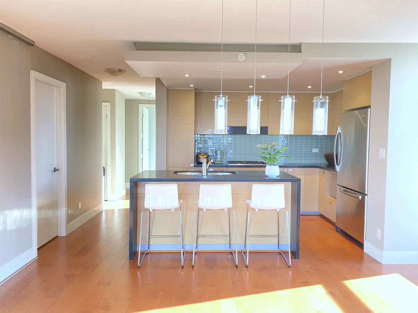 Kitchen island and breakfast bar at 604 – 1530 West 8th Ave