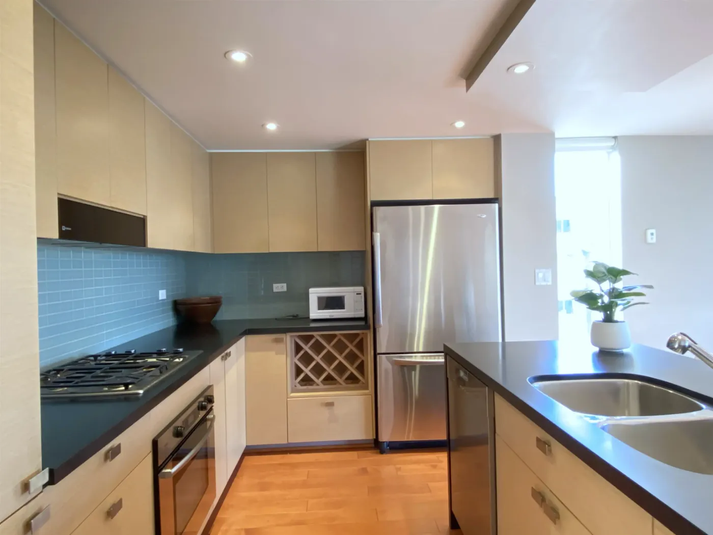 Gas range and cabinetry at 604 – 1530 West 8th Ave